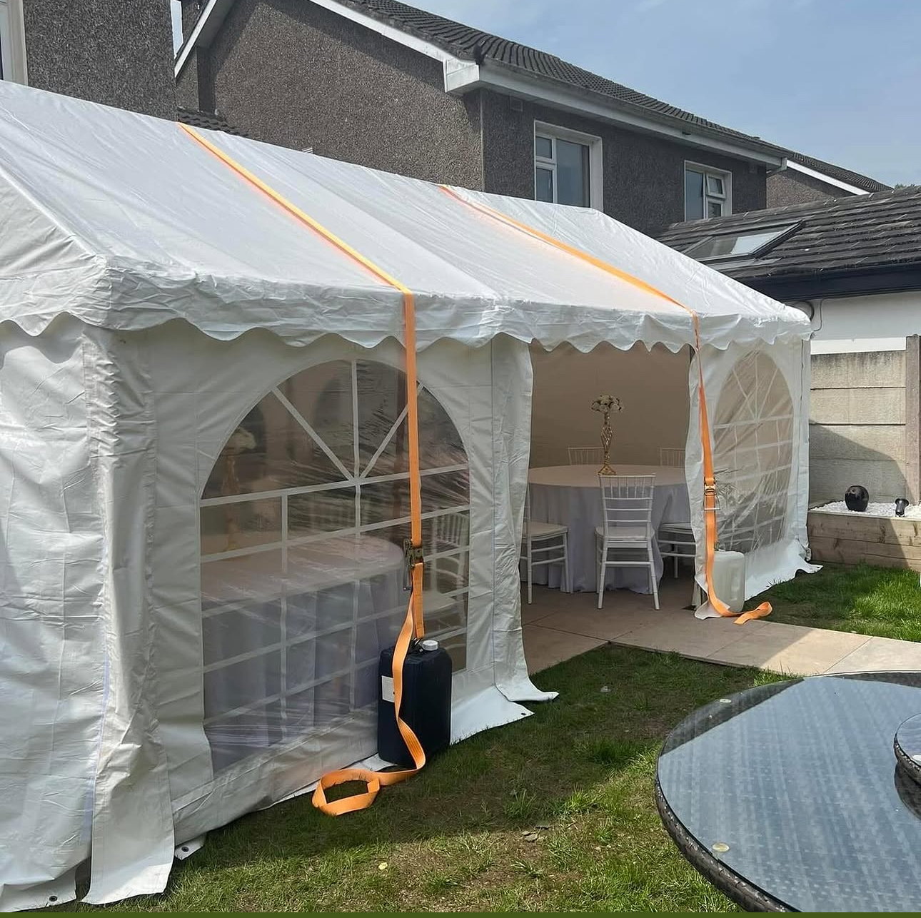 Compact marquee — 3m × 6m white frame structure in garden